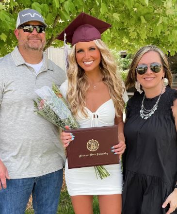 Bre Newcomer with her parents at her graduation